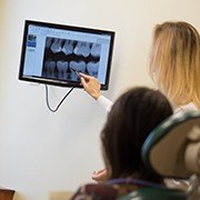 Dentist discussing the cost of dental implants with dental patient