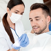 Invisalign dentist in Pepper Pike showing patient an Invisalign clear aligner