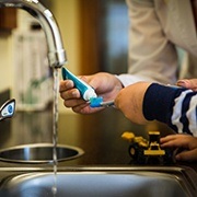 Child practicing tooth brushing