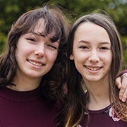 Two young women with beautiful smiles after cosmetic dentistry