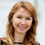 Happy woman smiling after porcelain veneer treatment