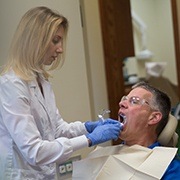 Dentist performing metal free dental crown restorations