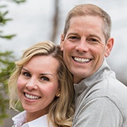 Man and woman sharing attractive smiles after dental bonding