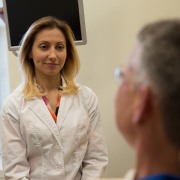 Dentist discussing full mouth reconstruction with dental patient