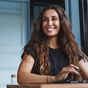 Woman smiling with dental crowns in Pepper Pike