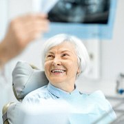 dentist showing patient X-ray