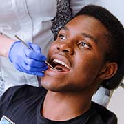 Patient visiting their Pepper Pike emergency dentist for dental checkup and teeth cleaning