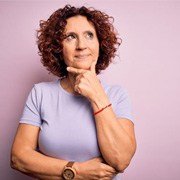 Mature woman with curious expression on her face