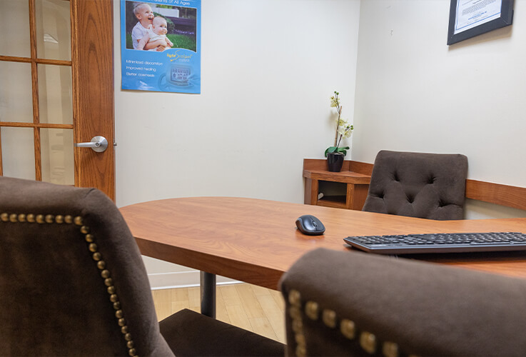 Dr. Csok speaking with a dental implant patient