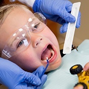 Young patient receiving fluoride treatment