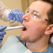 Patient receiving oral cancer screening