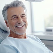 Smiling older man in dental treatment chair