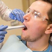 Dentist using intraoral camera to capture smile images