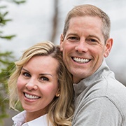 Man and woman smiling after T M J therapy