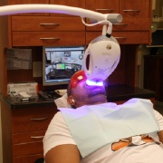 Man undergoing ZOOM! teeth whitening treatment
