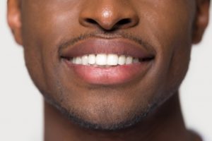 Man with beautiful smile after visiting Cleveland cosmetic dentist