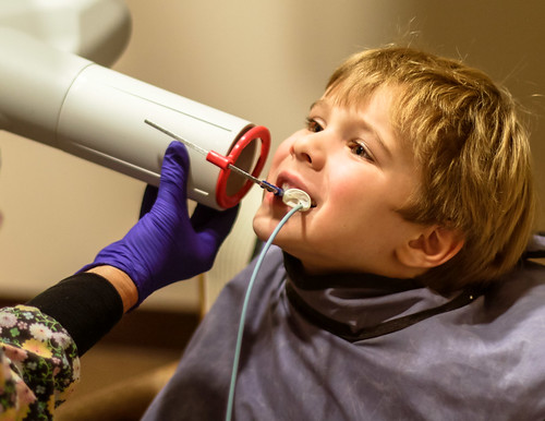 child at dentist after knocking out a tooth